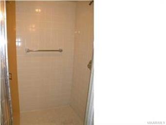 Master bath has tile shower
