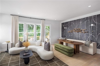 Living area featuring dark hardwood / wood-style f