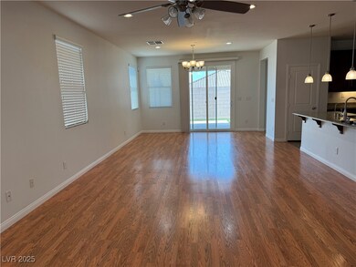 Unfurnished living room featuring a ceiling fan, a