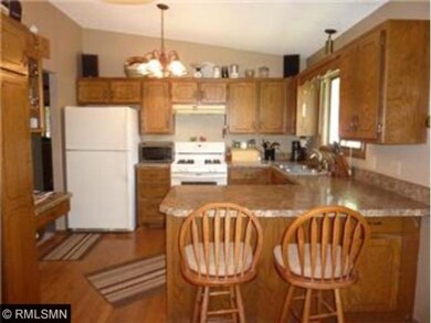 The spacious kitchen has lots of cabinetry and an 