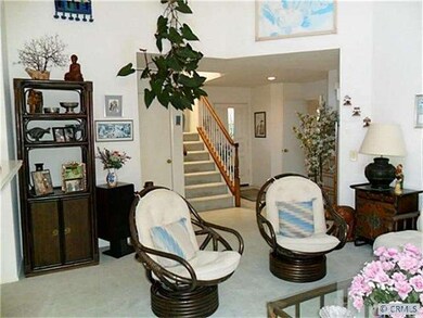 View from living room.  Custom staircase leads to 