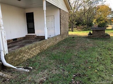 Carport side, well.
