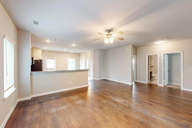 Unfurnished living room with ceiling fan, a wealth