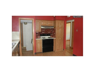 Updated kitchen includes laminate flooring, range,