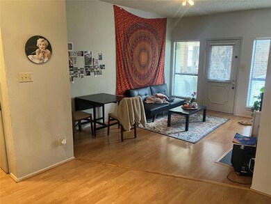Living room featuring wood finished floors, baseb