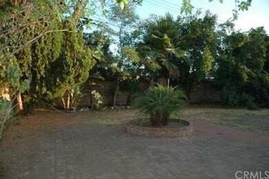 Large Back Yard With Brick Paving