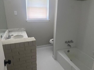 Bathroom with toilet, vanity, and bathing tub / shower combination
