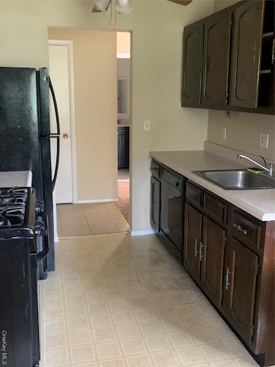 Kitchen with range, light countertops, ceiling fan, dishwashing machine, and dark brown cabinetry