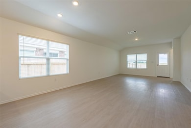 Spare room featuring light wood finished floors, 