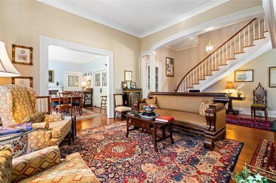 View of the Living Room, Foyer, and the Dining Room.