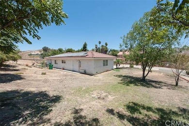 Left side yard view with 21 solar panels included 