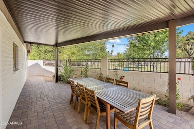 Paver side patio with view fence