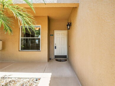 Doorway to property featuring stucco siding