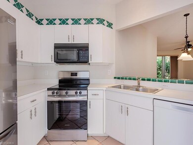 Kitchen featuring light tile patterned flooring, p