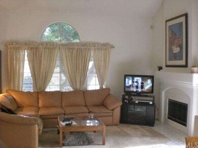 Living room with wood-burning fireplace