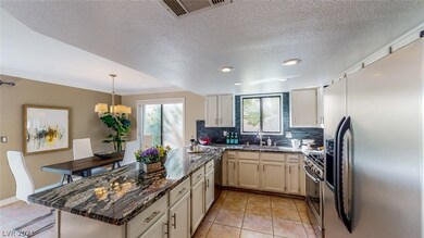Kitchen with custom countertops, stainless steel a