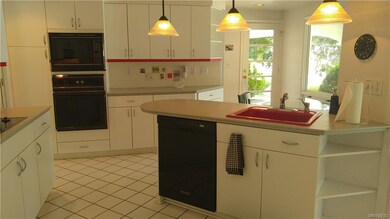 The custom designed kitchen offers a generous amou