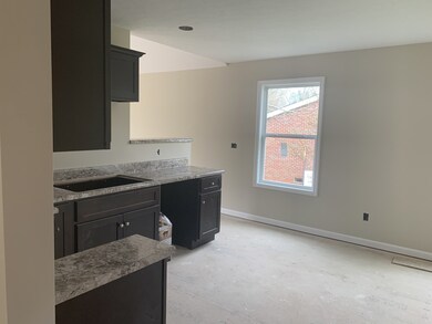 Kitchen w/semi opening to living room