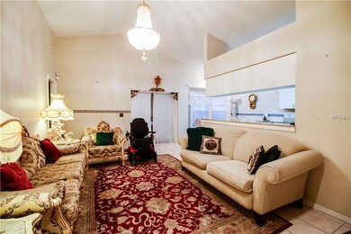 Living room, bonus room behind the curtains.