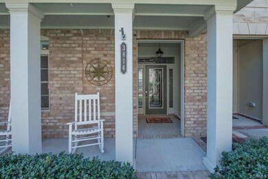 Relax and chat with neighbors on your covered fron