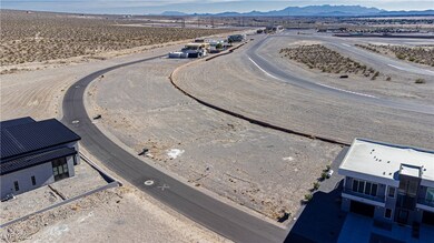 Drone / aerial view of a mountain backdrop and a desert landscape
