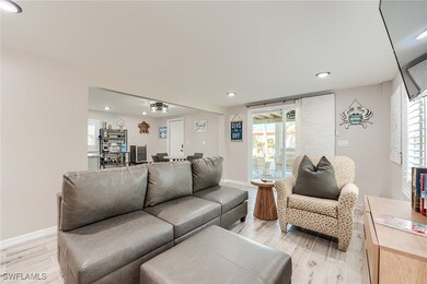 1st Floor Living area with recessed lighting and light wood finished floors- Virtually Edited Image