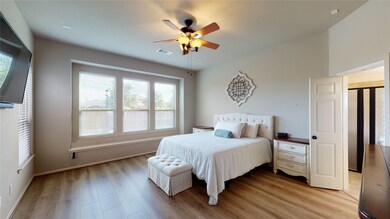 Come and unwind after a long day in this magnificent master suite! This spacious room features a dark stained ceiling fan with lighting, custom paint, wood flooring and large windows with privacy blinds.