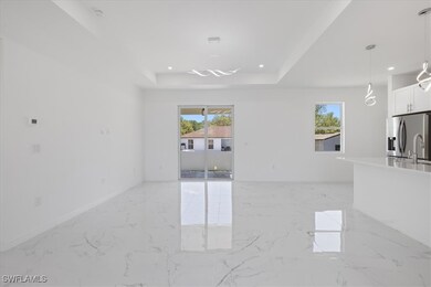 Unfurnished living room featuring marble finish fl
