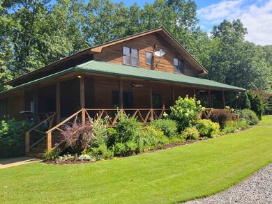 View of front of home with covered porch and a fro