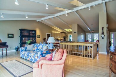 View towards breakfast table area, kitchen, and separate formal dining room.