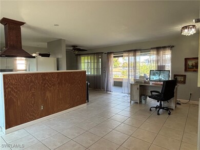 Featuring ceiling fan and light tile patterned flo