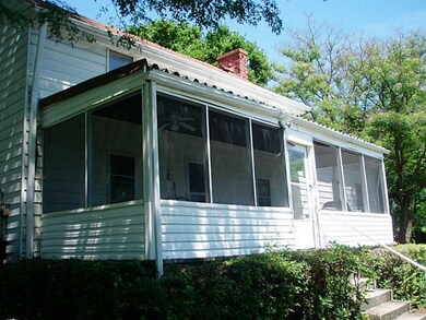 Exterior Back. Screened in sun porch for relaxing 