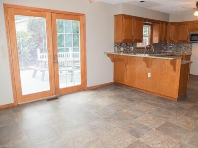 Large dinette with deck access.