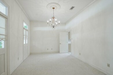 Formal dining room with lovely chandelier.