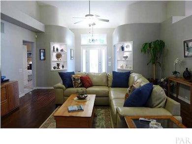 Amenities and features galore make this a truly turnkey home. Notice the rounded bookshelves, high ceilings, plant ledges and vaulted ceiling in the great room.