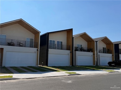 Modern home featuring stucco siding and an attached garage