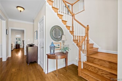 Staircase with dark hardwood / wood-style floors a