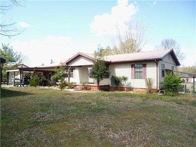 This home is well maintained and completed renovated inside.  It sits on almost 1 acre and has a driveway entrance on both ends of the front property lines.