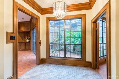 Walk into elegance as you enter the front door.  Experience outdoors immediately from the inside out.  The front door opens to this large, formal foyer with herringbone tile and high ceilings.  Peak outside to embrace the elegance of this executive style home.  Opportunities for entertaining in every room.