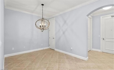 Unfurnished room featuring crown molding and a cha