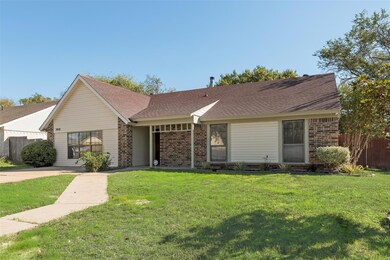 Ranch-style home featuring a front lawn