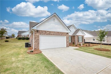 View of front of property featuring a garage and a