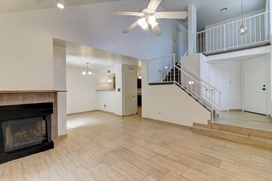 Living room with loft above