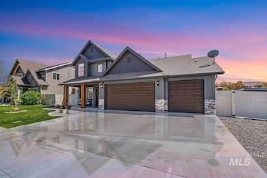 View of front of property featuring a garage, stone siding, concrete driveway, and a shingled roof