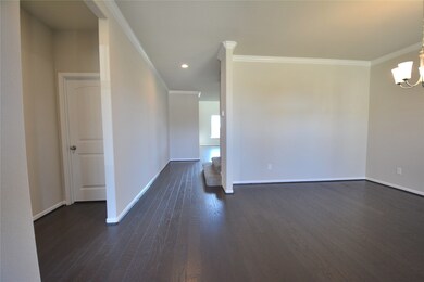 As you enter you will be welcome with High Ceilings trimmed with Crown Molding, Wood Floors and more!