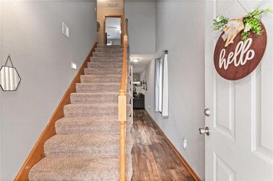 Stairs featuring dark hardwood / wood-style floors