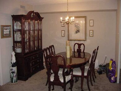 Dining area joins the spacious living room.