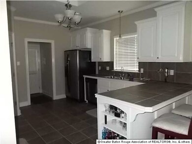 newly redecorated kitchen with granite tops and cu
