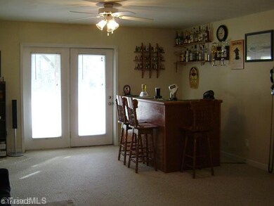 Den/Family/Great Room. Large Den on Lower Level is Perfect for Entertaining. Doors Open to Back Patio and Pool Area.