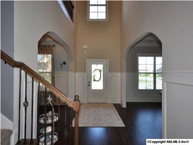 DRAMATIC FRONT FOYER WELCOMES YOU HOME